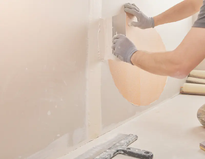 Close-up of drywall texture matching and finishing work